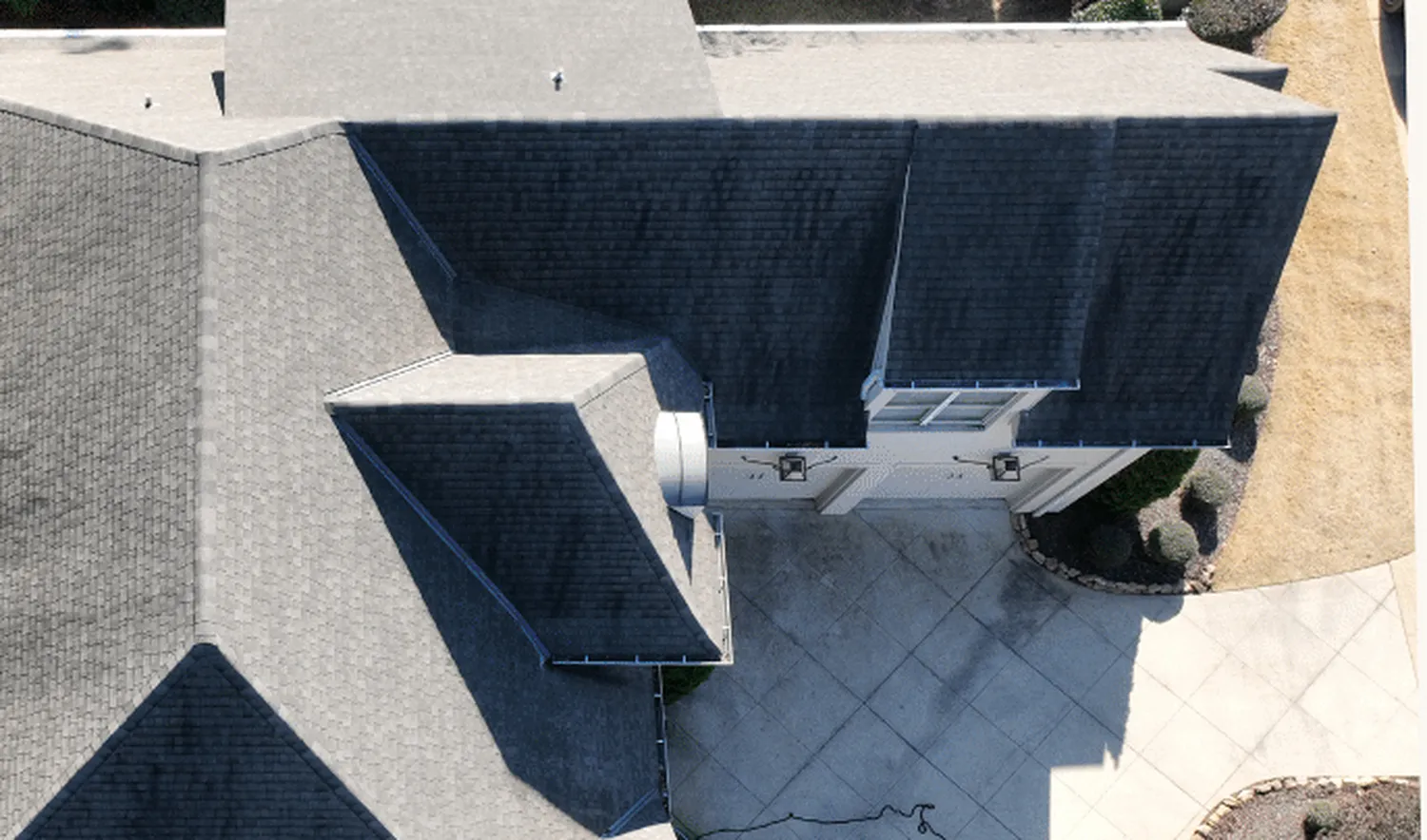 Before treatment — aerial view of a full residential roof